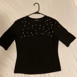 it is a black shirt with pearls, from shein size large